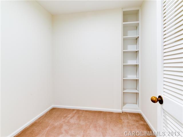808 Cherokee Road, Unit J1 Charlotte, NC 28207 - Photo 9 of 16 a view of a room with shelf on the wall