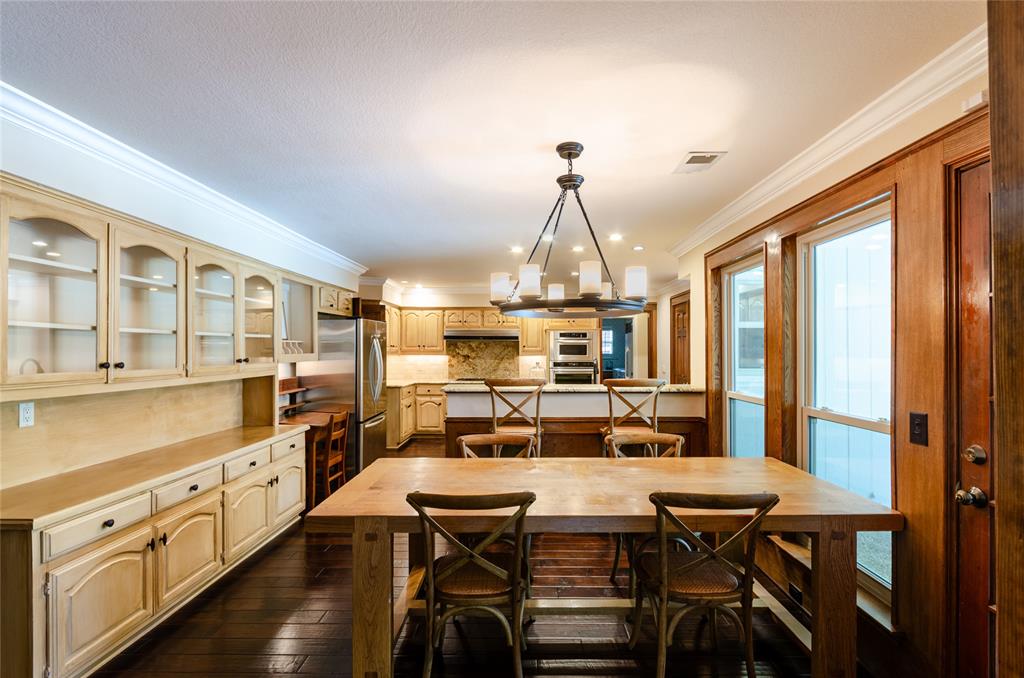 2605 Rothland Lane Plano, TX 75023 - Photo 11 of 40 a view of a dining room with furniture window and wooden floor