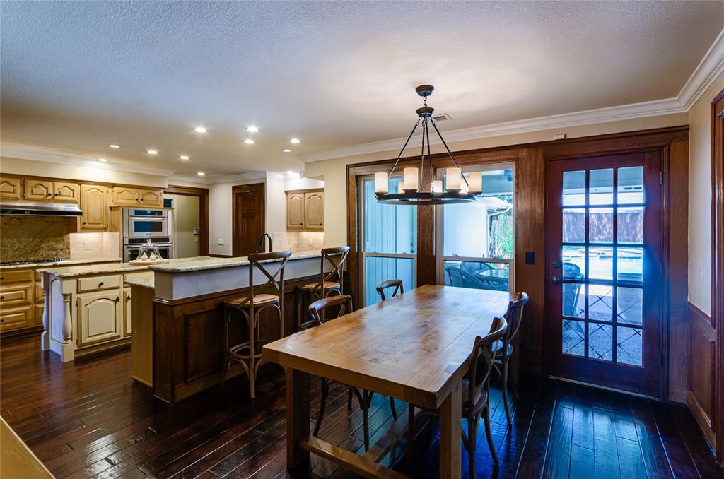 2605 Rothland Lane Plano, TX 75023 - Photo 14 of 40 a open kitchen with stainless steel appliances granite countertop a refrigerator dining table and chairs