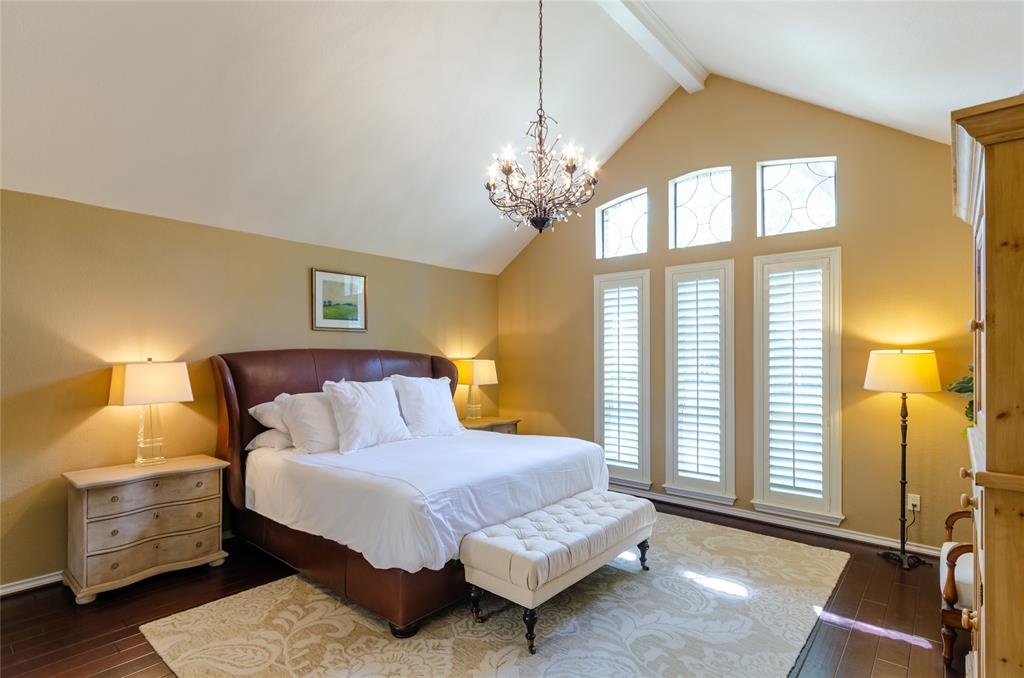 2605 Rothland Lane Plano, TX 75023 - Photo 15 of 40 a bedroom with a bed and a night stand