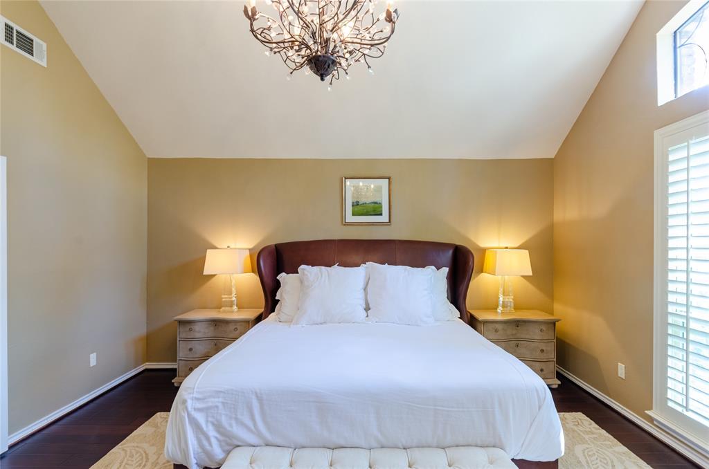 2605 Rothland Lane Plano, TX 75023 - Photo 16 of 40 a bedroom with a bed and lamps