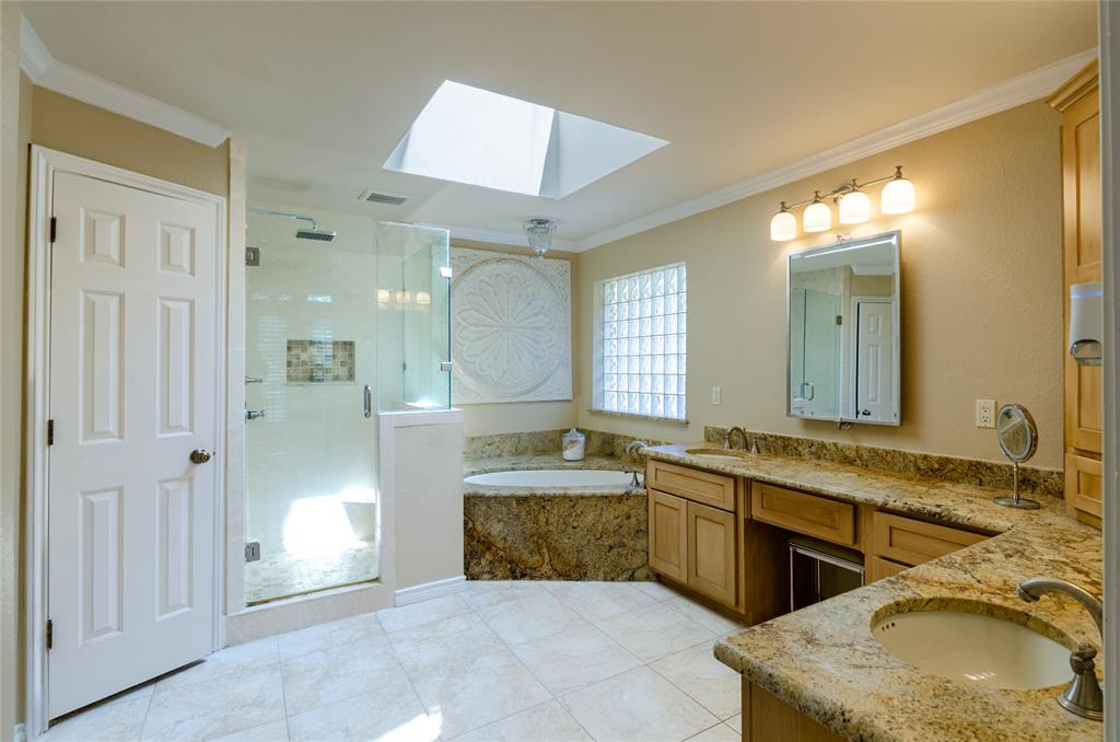 2605 Rothland Lane Plano, TX 75023 - Photo 18 of 40 a bathroom with a sink and a mirror