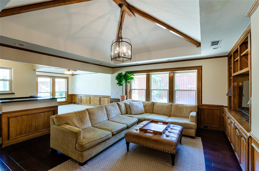 2605 Rothland Lane Plano, TX 75023 - Photo 20 of 40 a living room with furniture and a flat screen tv