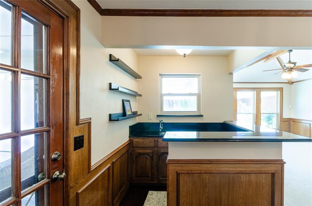 2605 Rothland Lane Plano, TX 75023 - Photo 22 of 40 a kitchen with a sink and a refrigerator