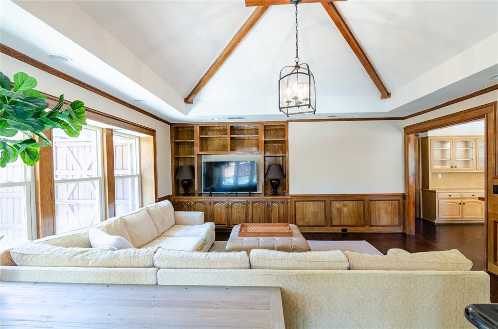 2605 Rothland Lane Plano, TX 75023 - Photo 23 of 40 a living room with furniture and a flat screen tv