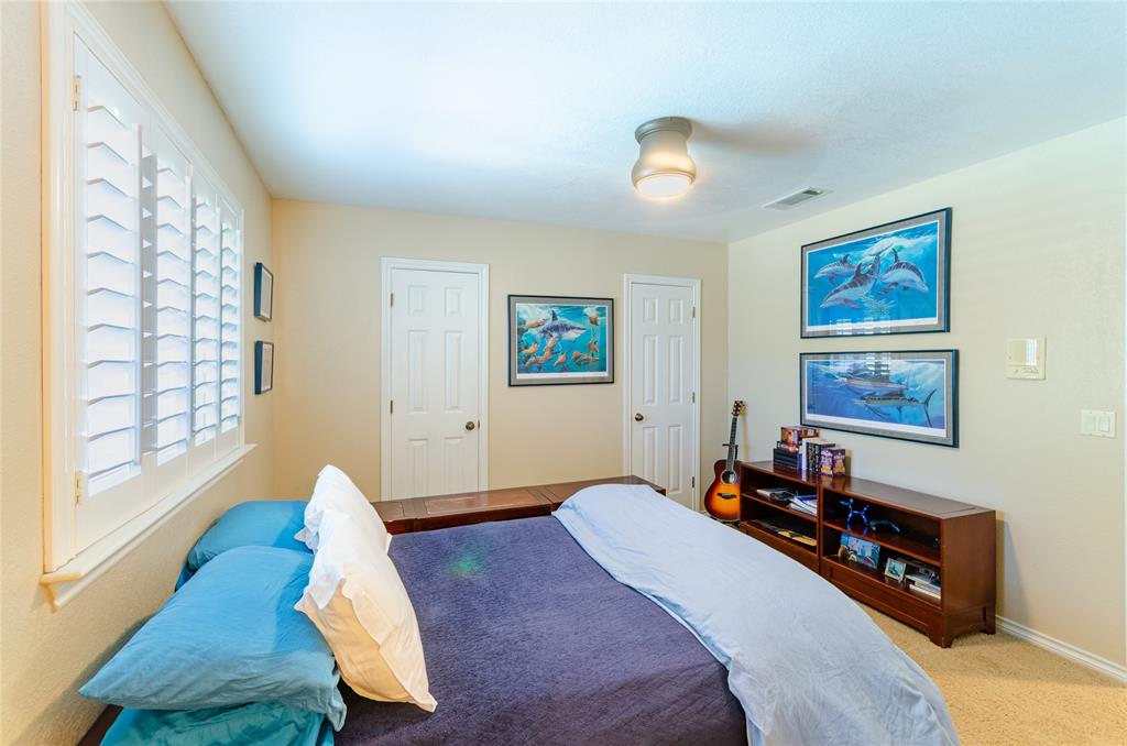 2605 Rothland Lane Plano, TX 75023 - Photo 29 of 40 a bedroom with bed and a window