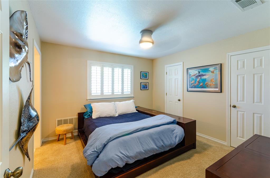2605 Rothland Lane Plano, TX 75023 - Photo 30 of 40 a bedroom with a bed and a window