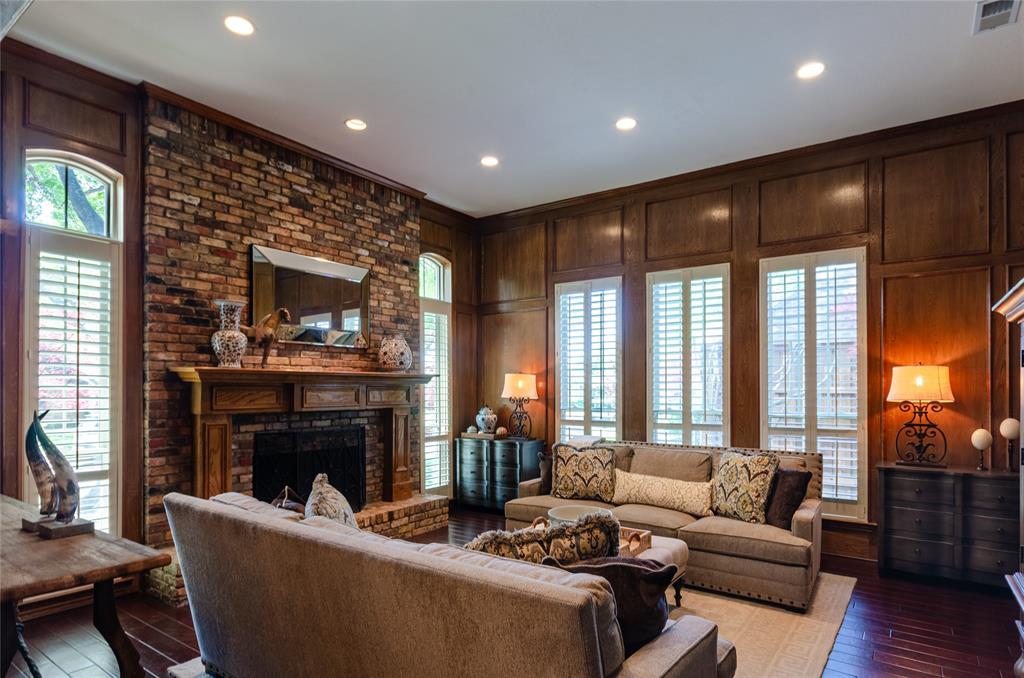 2605 Rothland Lane Plano, TX 75023 - Photo 3 of 40 a living room with furniture a large window and a fireplace