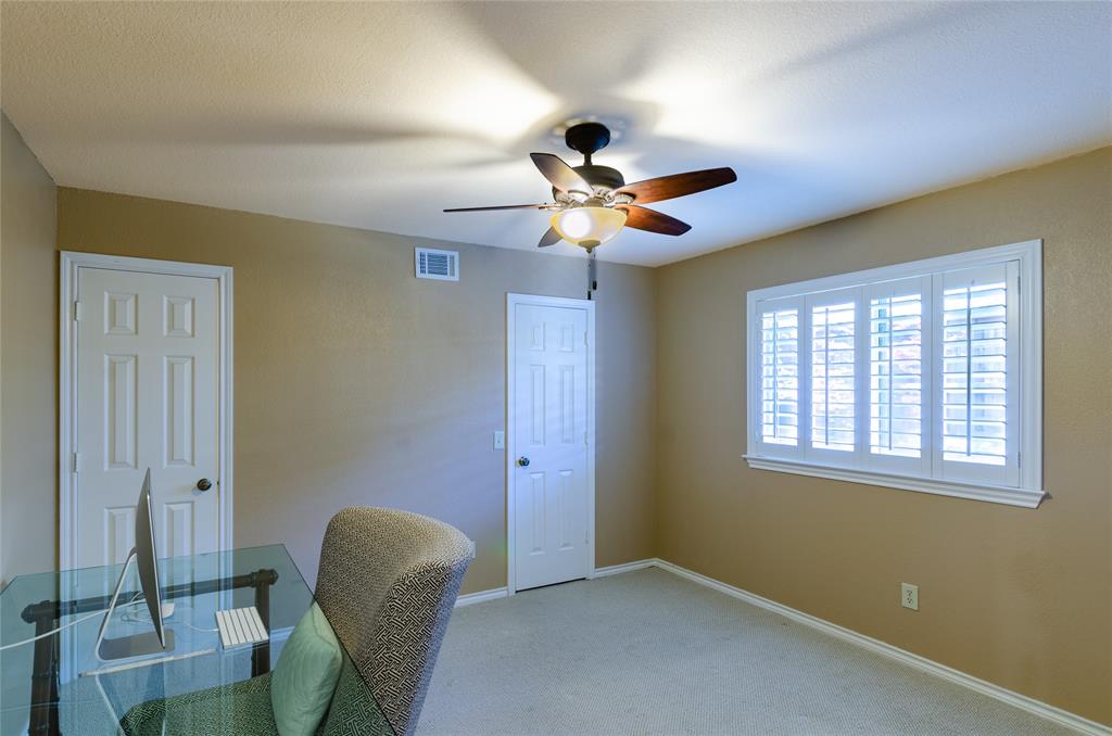 2605 Rothland Lane Plano, TX 75023 - Photo 31 of 40 a view of workspace with chair and a ceiling fan