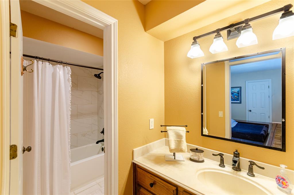 2605 Rothland Lane Plano, TX 75023 - Photo 34 of 40 a bathroom with a granite countertop sink mirror and a