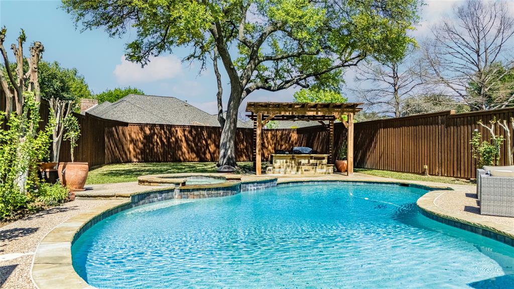 2605 Rothland Lane Plano, TX 75023 - Photo 38 of 40 a view of a swimming pool with a patio