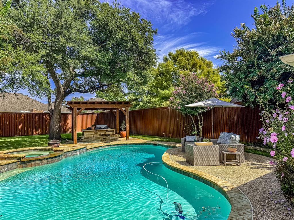 2605 Rothland Lane Plano, TX 75023 - Photo 39 of 40 a view of a chair and table in backyard of the house
