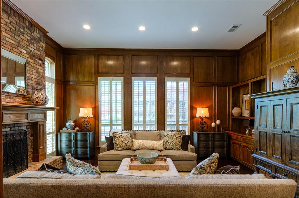 2605 Rothland Lane Plano, TX 75023 - Photo 4 of 40 a living room with fireplace furniture and a floor to ceiling window