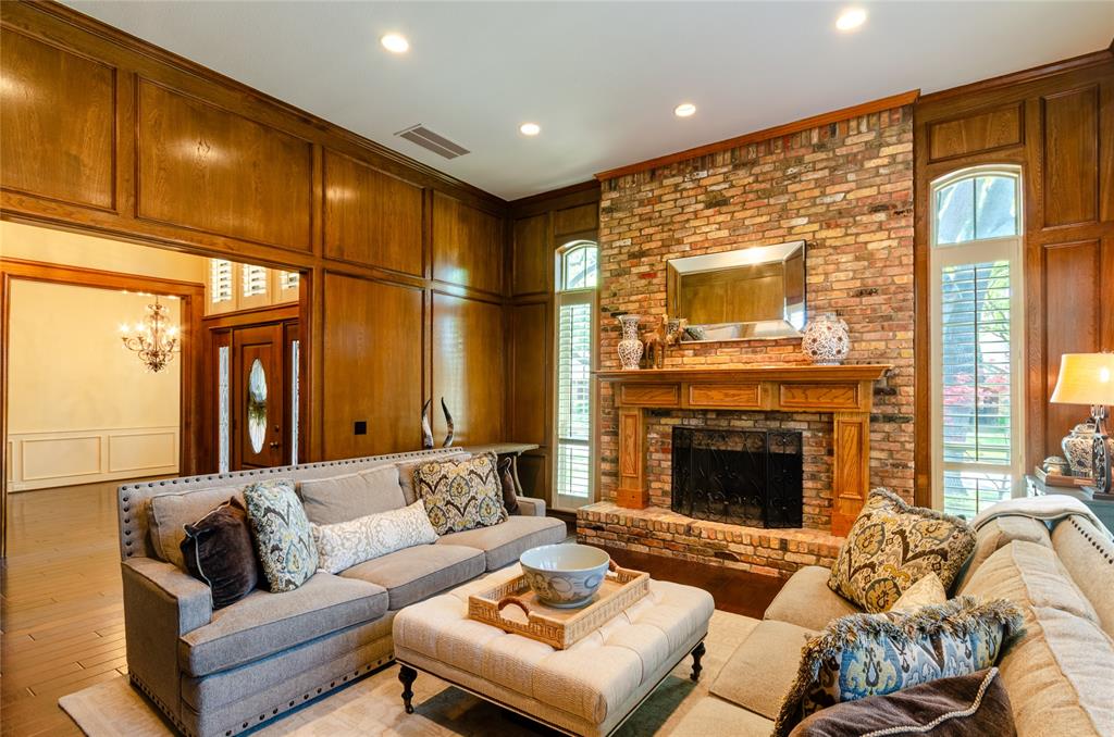 2605 Rothland Lane Plano, TX 75023 - Photo 6 of 40 a living room with furniture fireplace and a flat screen tv