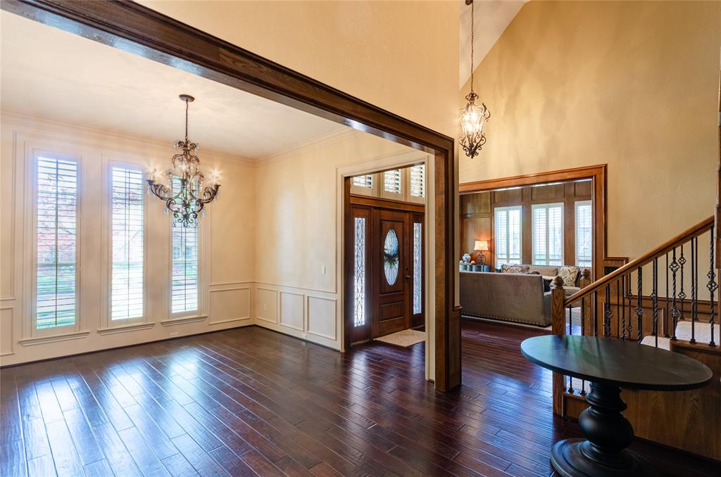 2605 Rothland Lane Plano, TX 75023 - Photo 8 of 40 a view of a livingroom with furniture window wooden floor and front door