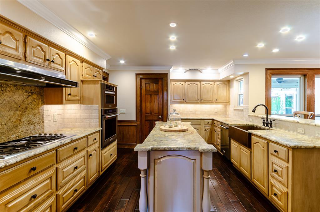 2605 Rothland Lane Plano, TX 75023 - Photo 9 of 40 a kitchen with sink stove and refrigerator
