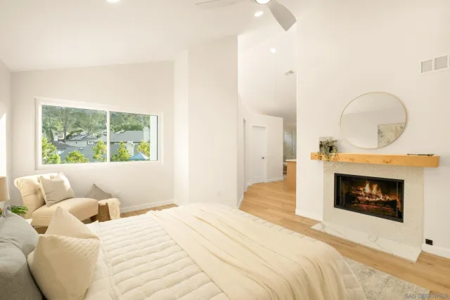 a bedroom with a bed and a chair