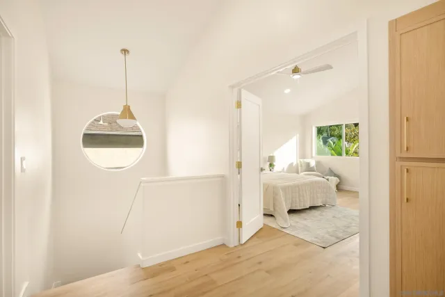 a view of a patio with table and chairs with wooden floor and fence