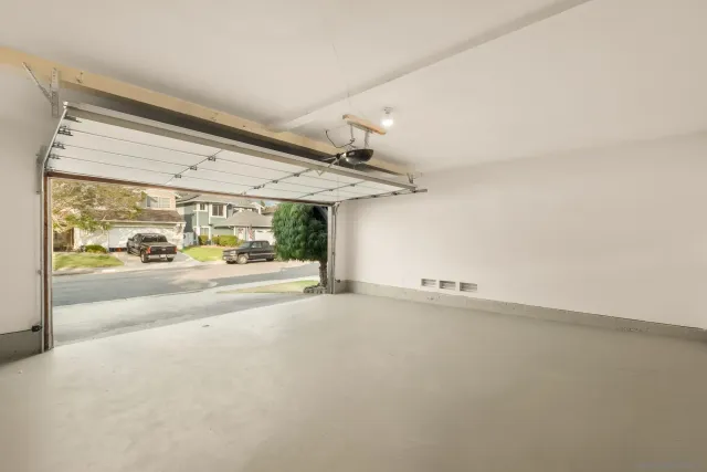 a view of a dinning table and chairs in backyard of the house