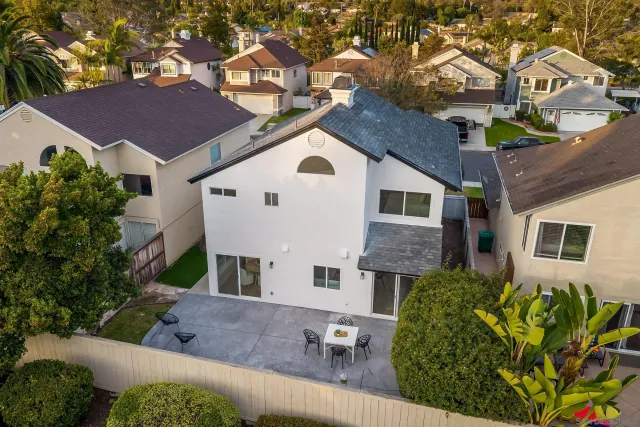 an aerial view of residential building and trees around