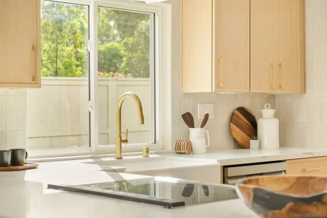 a kitchen with a sink and a window