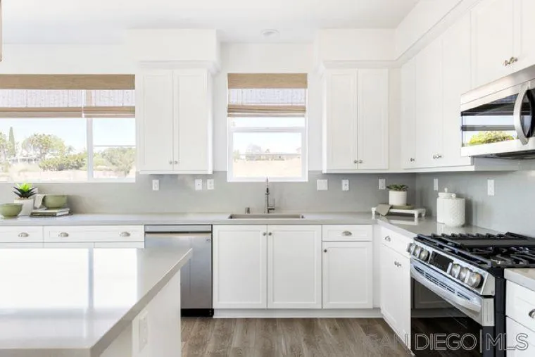 2220 South Ava Glen, Unit 906 Escondido, CA 92025 - Photo 13 of 23 a kitchen with cabinets appliances a sink and a window
