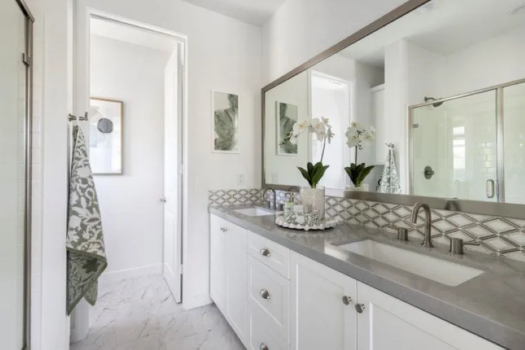 2220 South Ava Glen, Unit 906 Escondido, CA 92025 - Photo 17 of 23 a bathroom with a granite countertop sink and a mirror