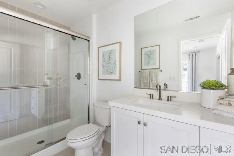 2220 South Ava Glen, Unit 906 Escondido, CA 92025 - Photo 5 of 23 a bathroom with a sink a toilet and shower