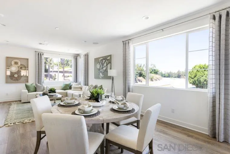 2220 South Ava Glen, Unit 906 Escondido, CA 92025 - Photo 10 of 23 a dining room with furniture a large window and garden view