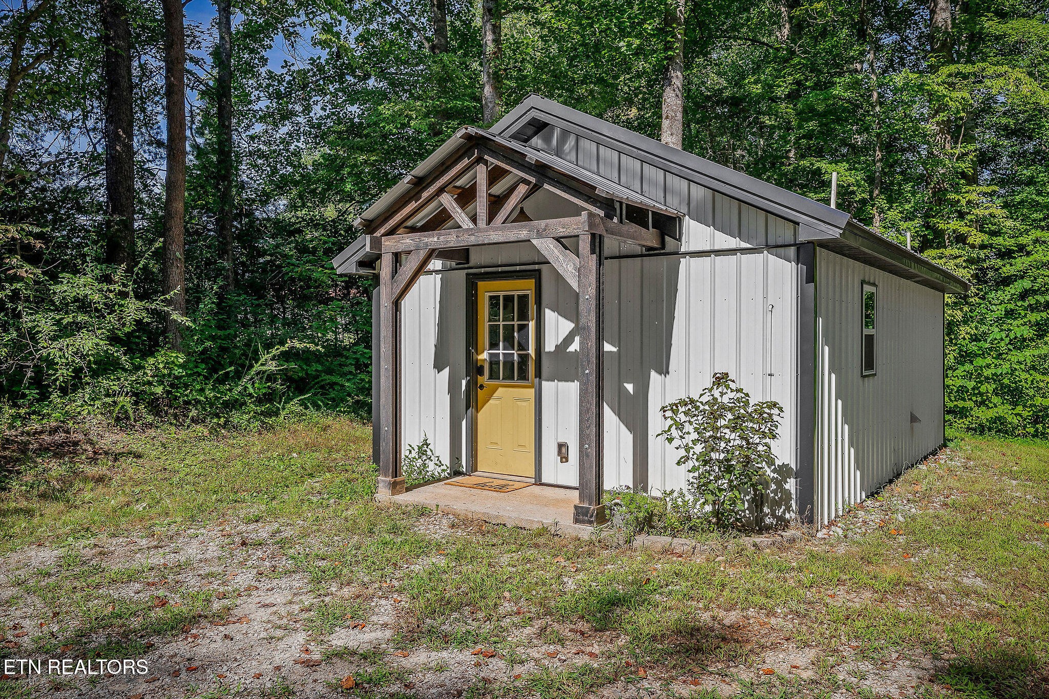 a house with trees in front of it