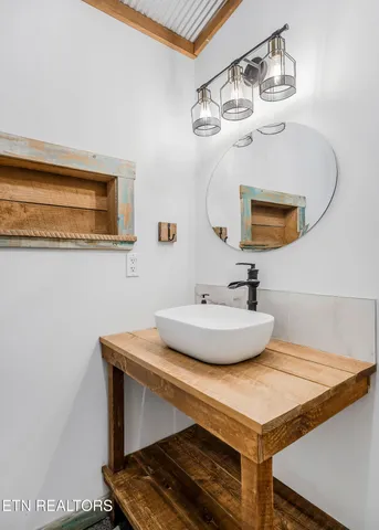 a bathroom with a sink and a mirror