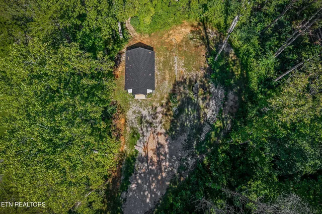 a view of a yard from a balcony