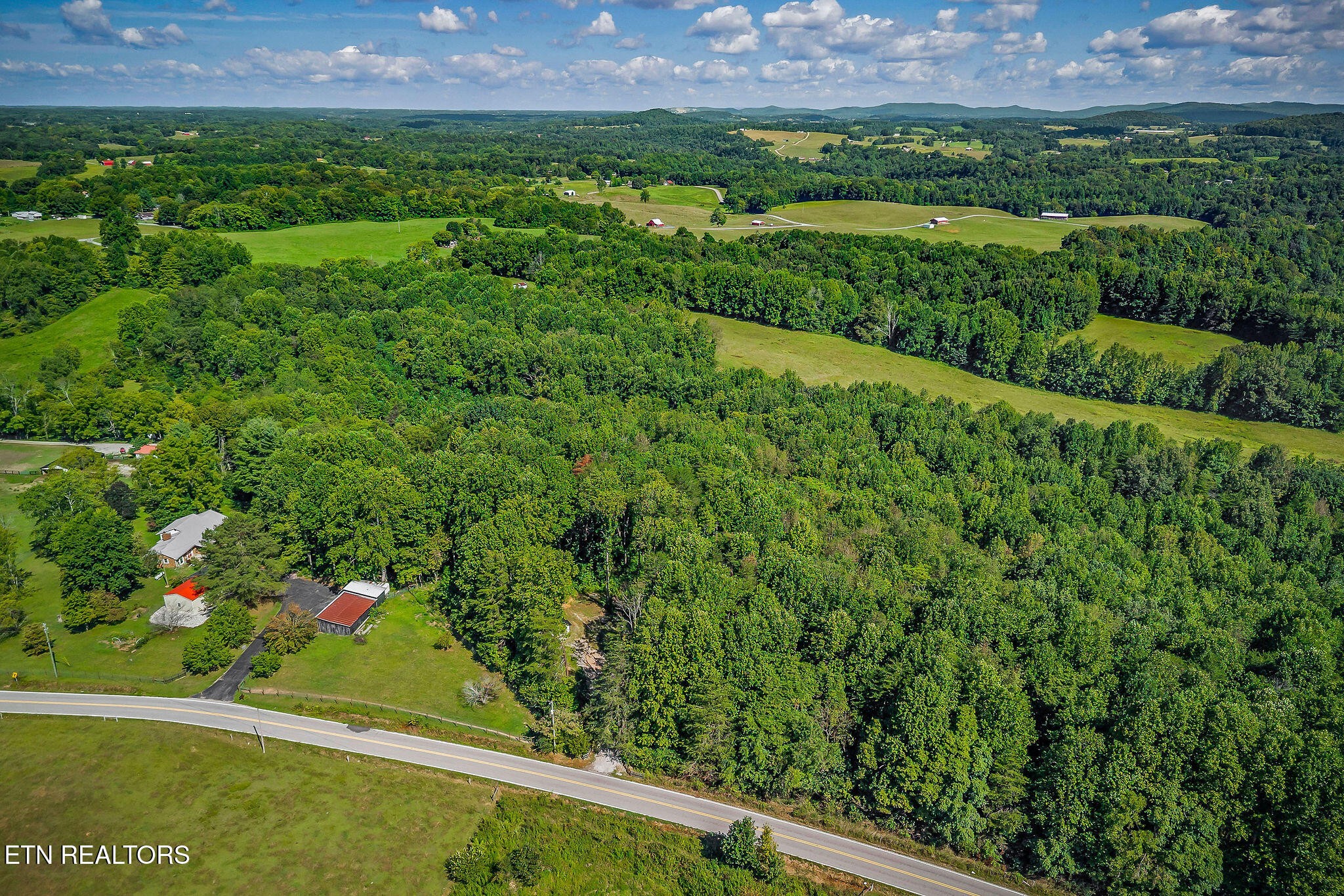 3247 Moodyville Road Byrdstown, TN 38549 - Photo 17 of 27 a view of a lush green field