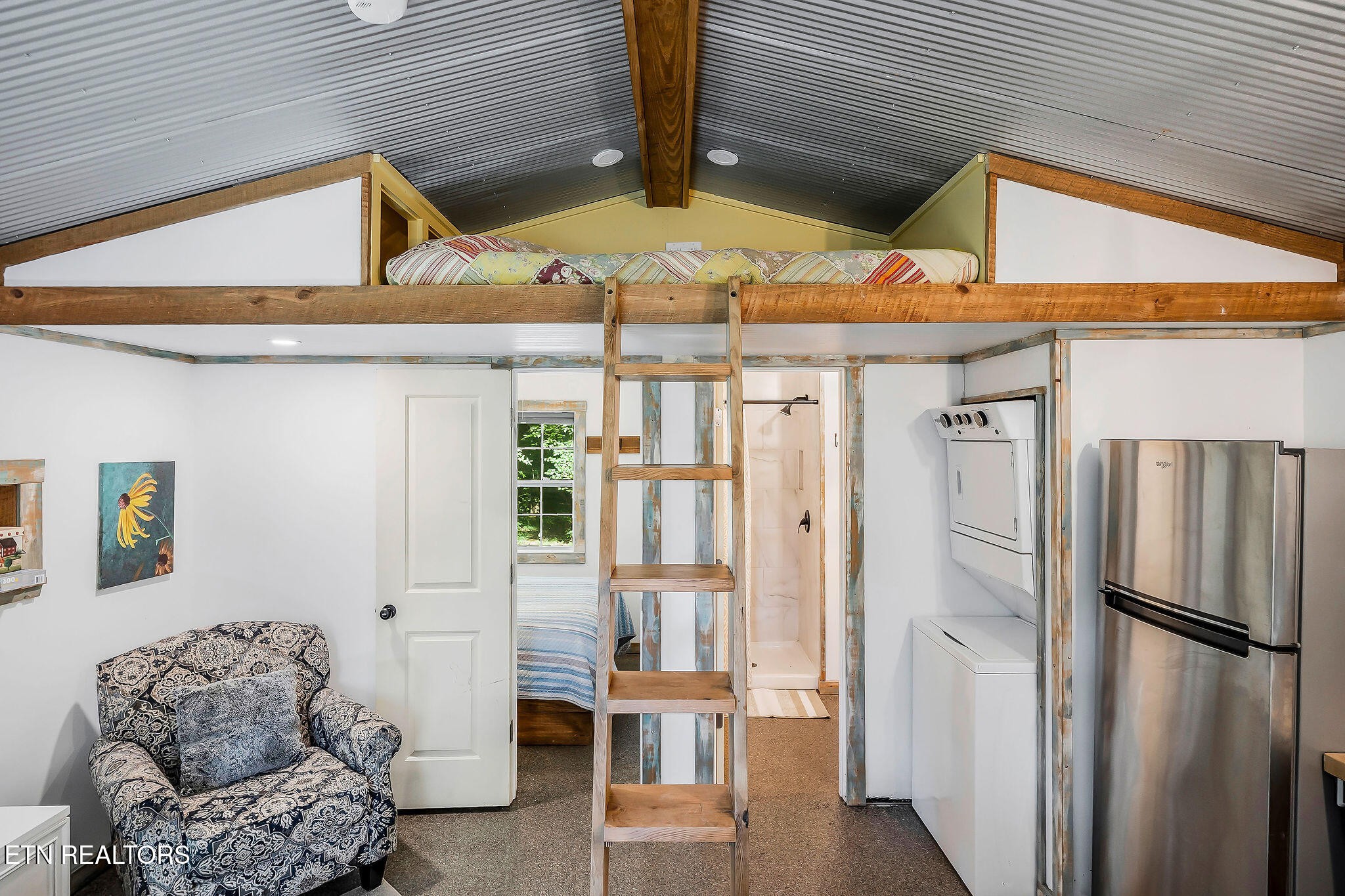 3247 Moodyville Road Byrdstown, TN 38549 - Photo 6 of 27 a kitchen with stainless steel appliances kitchen island granite countertop a refrigerator and a stove