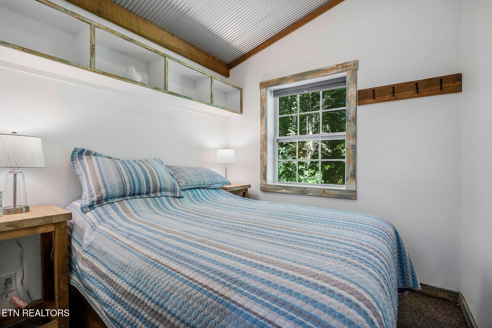 3247 Moodyville Road Byrdstown, TN 38549 - Photo 8 of 27 a bedroom with a bed and a window