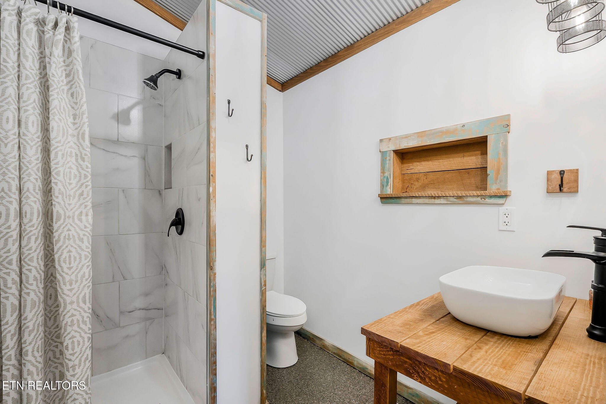 3247 Moodyville Road Byrdstown, TN 38549 - Photo 10 of 27 a bathroom with a granite countertop sink a toilet and shower