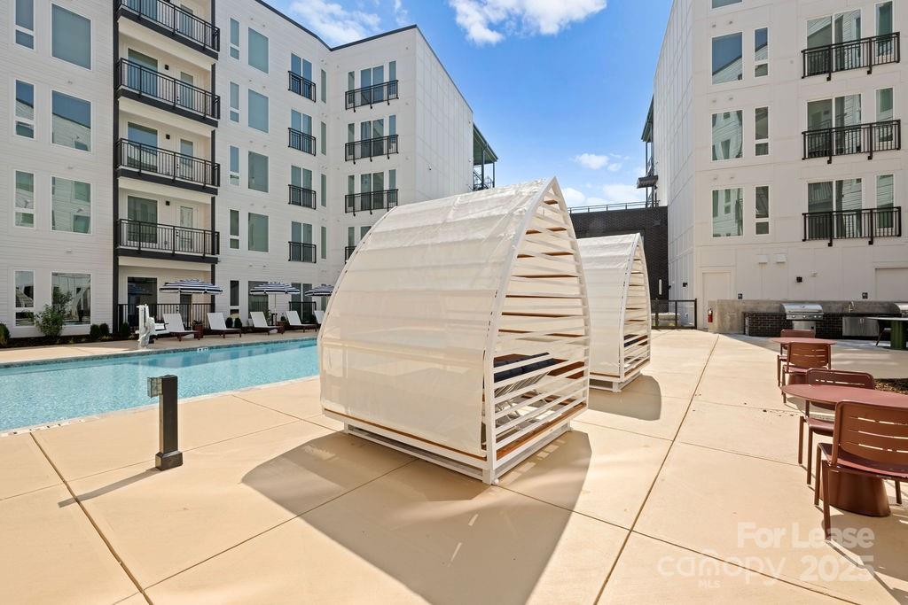4101 Raleigh Street, Unit S2 Charlotte, NC 28206 - Photo 21 of 48 a view of buildings with yard