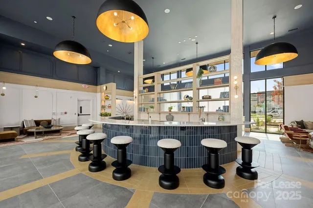 a view of living room with furniture and floor to ceiling window