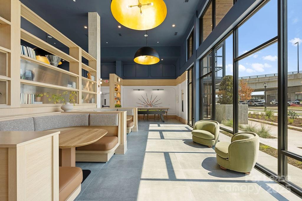 4101 Raleigh Street, Unit S2 Charlotte, NC 28206 - Photo 24 of 48 a view of living room with furniture and floor to ceiling window