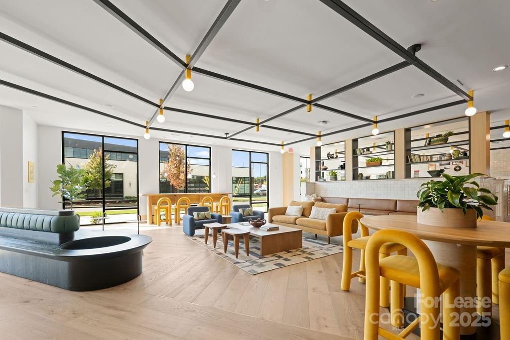 4101 Raleigh Street, Unit S2 Charlotte, NC 28206 - Photo 8 of 48 a living room with furniture and a large window