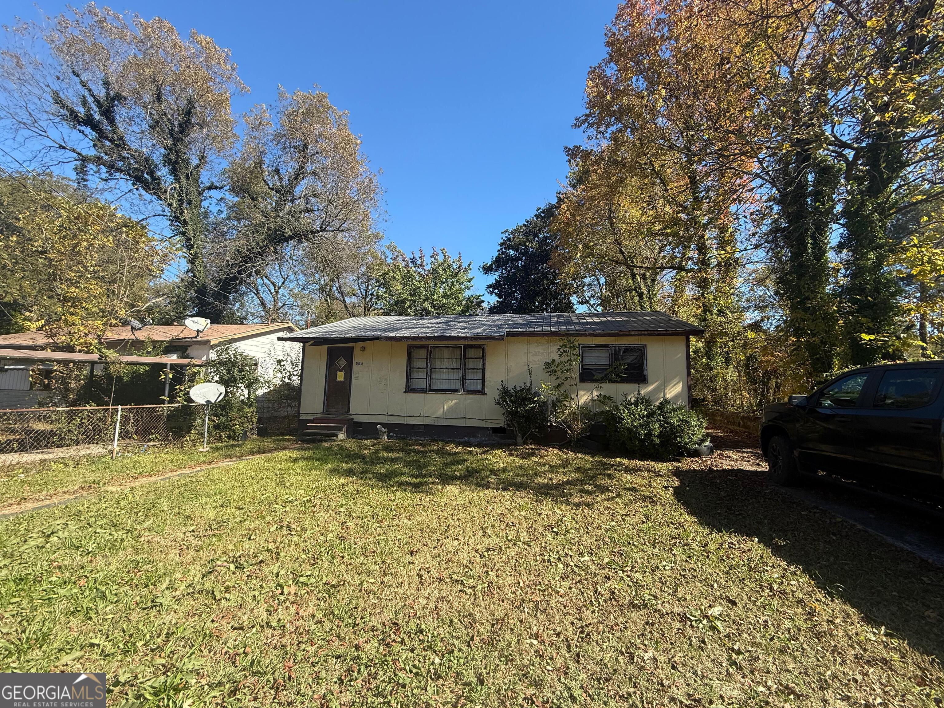 415 Branham Avenue Southwest Rome, GA 30161 - Photo 1 of 15 a view of a backyard with a large tree
