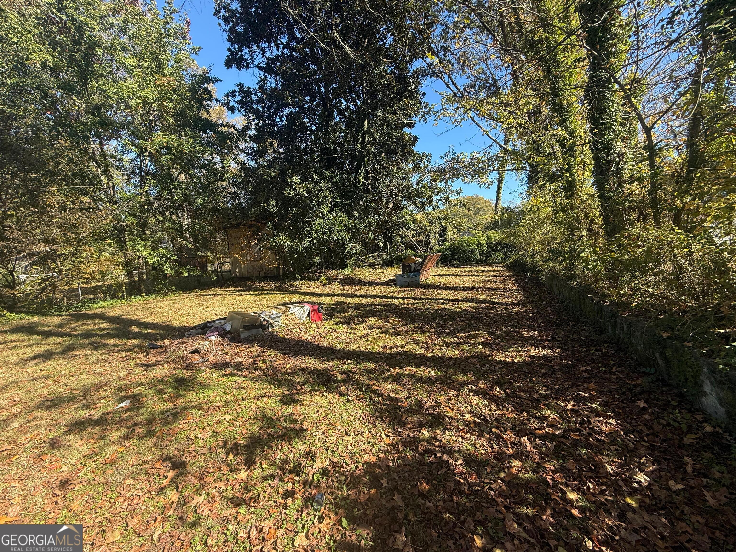 415 Branham Avenue Southwest Rome, GA 30161 - Photo 5 of 15 a backyard of a house with a yard and outdoor seating