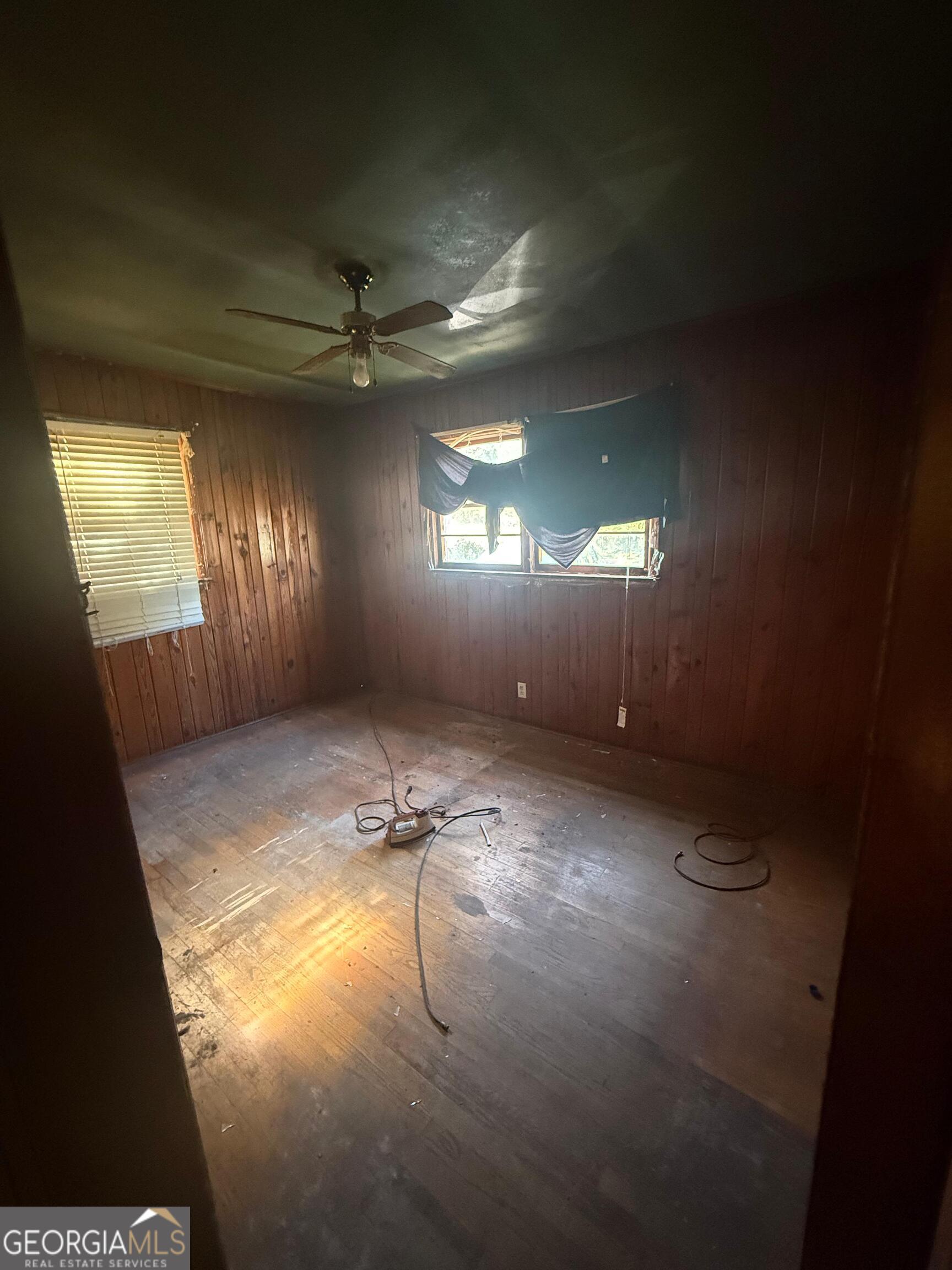 415 Branham Avenue Southwest Rome, GA 30161 - Photo 6 of 15 an empty room with windows and fan