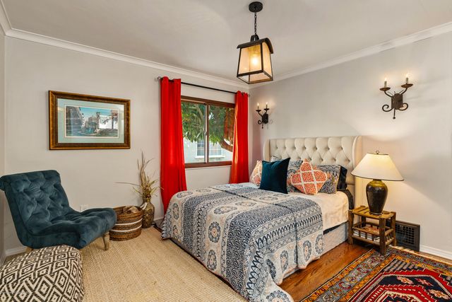 a bedroom with a bed furniture and a window