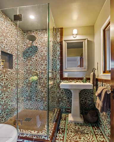 a bathroom with a bathtub and shower