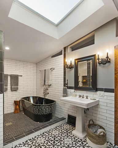 a bathroom with a sink a mirror and a bathtub