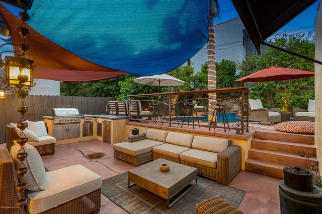 a view of a backyard with sitting area