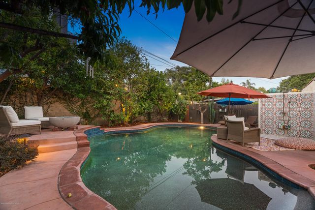 a view of a swimming pool with a patio