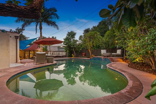 a view of yard with outdoor seating and green space