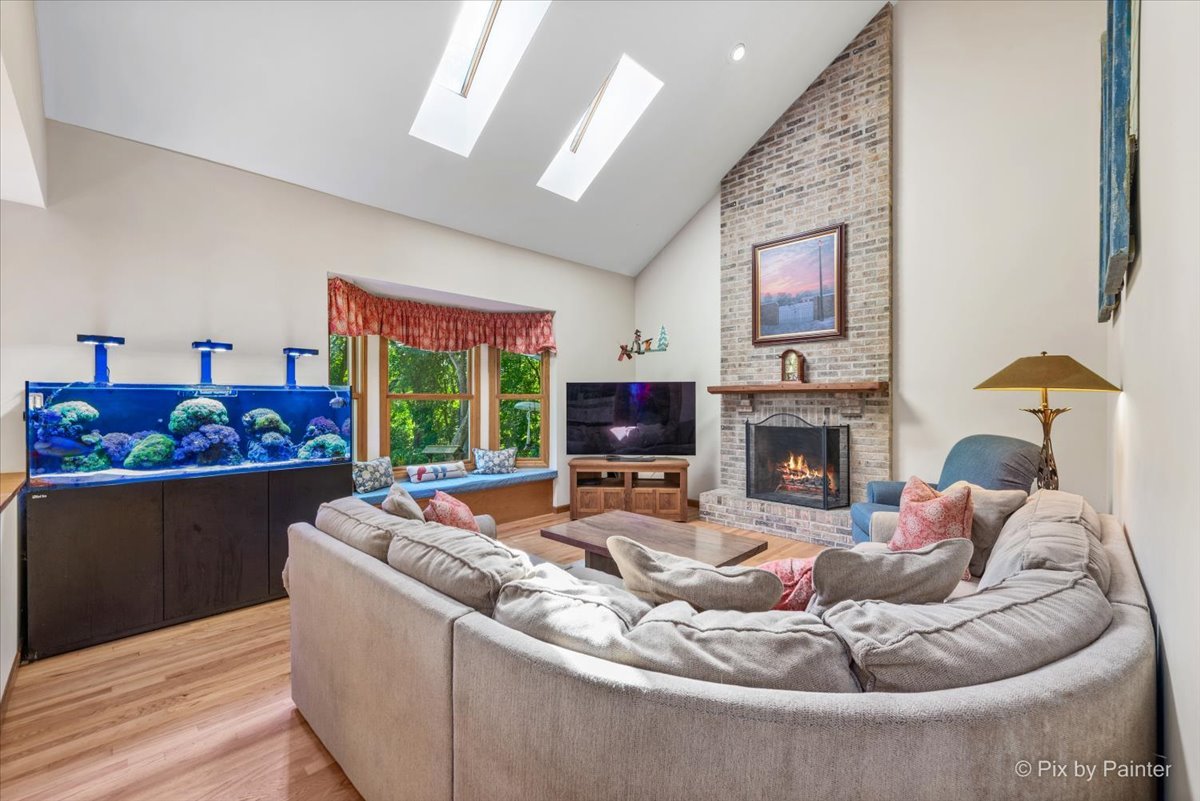 28683 Rivers Edge Drive Cary, IL 60013 - Photo 13 of 31 a living room with furniture fireplace and window